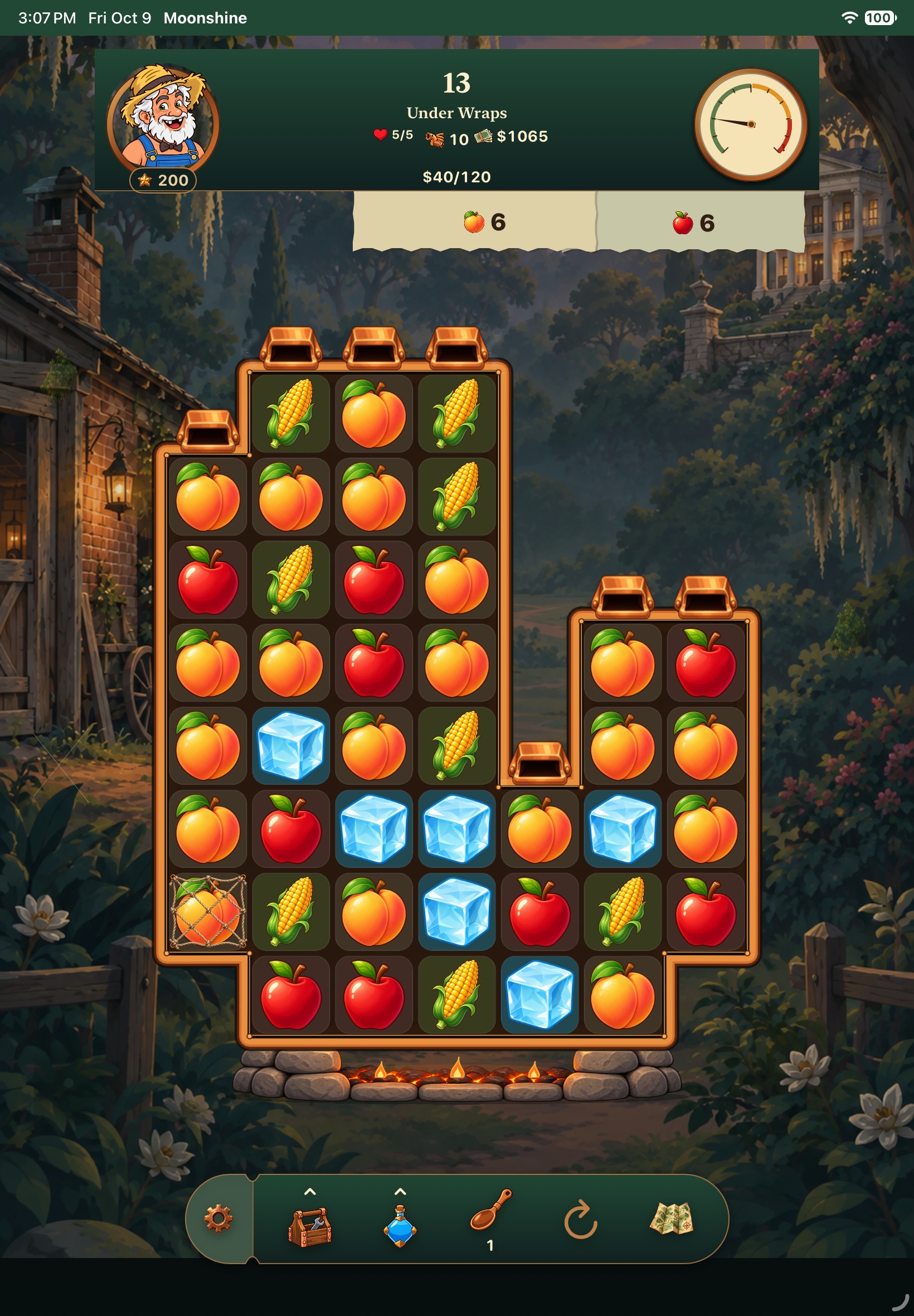 Development gameplay: peaches, apples, corn and cooling ice fill a copper still-shaped puzzle board.